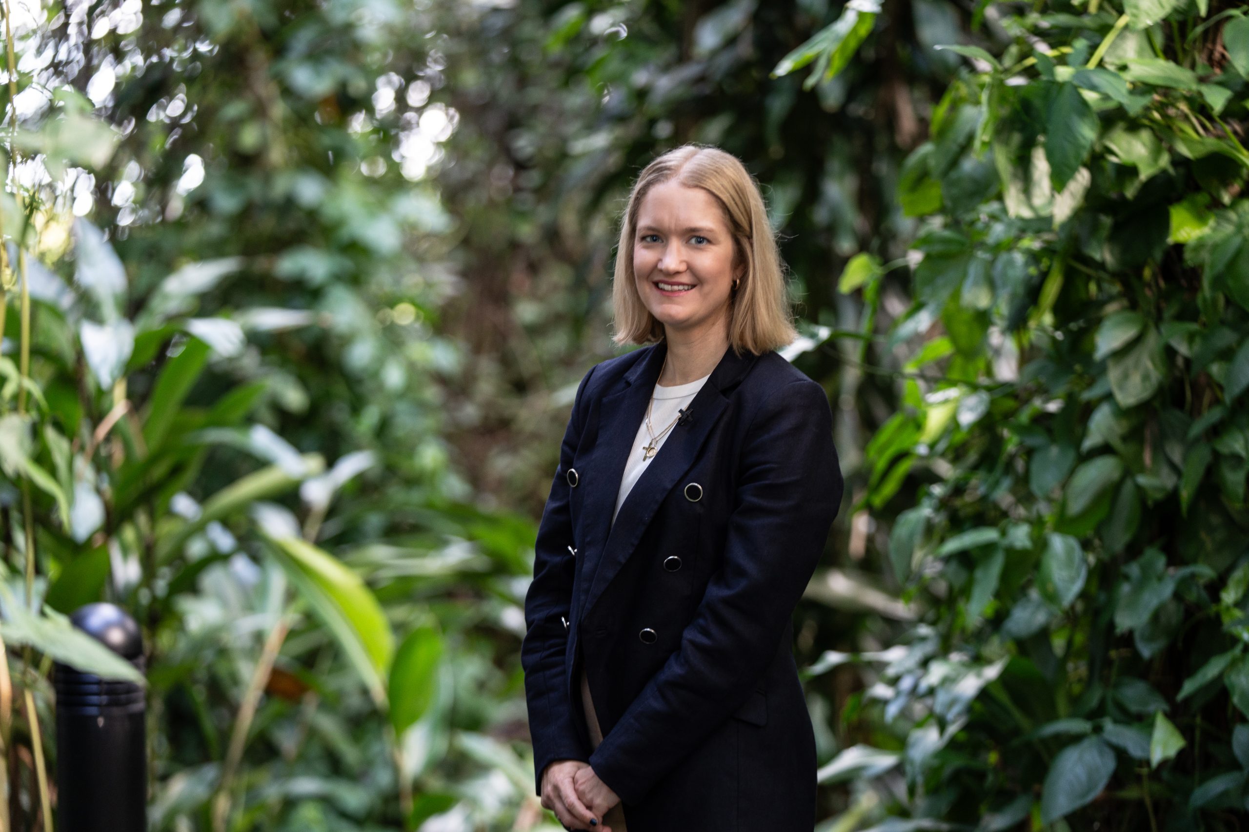 Madeline Beveridge standing in forest