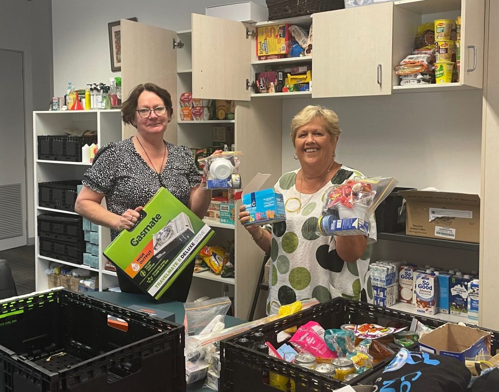 Parish volunteers packing bags of food for people