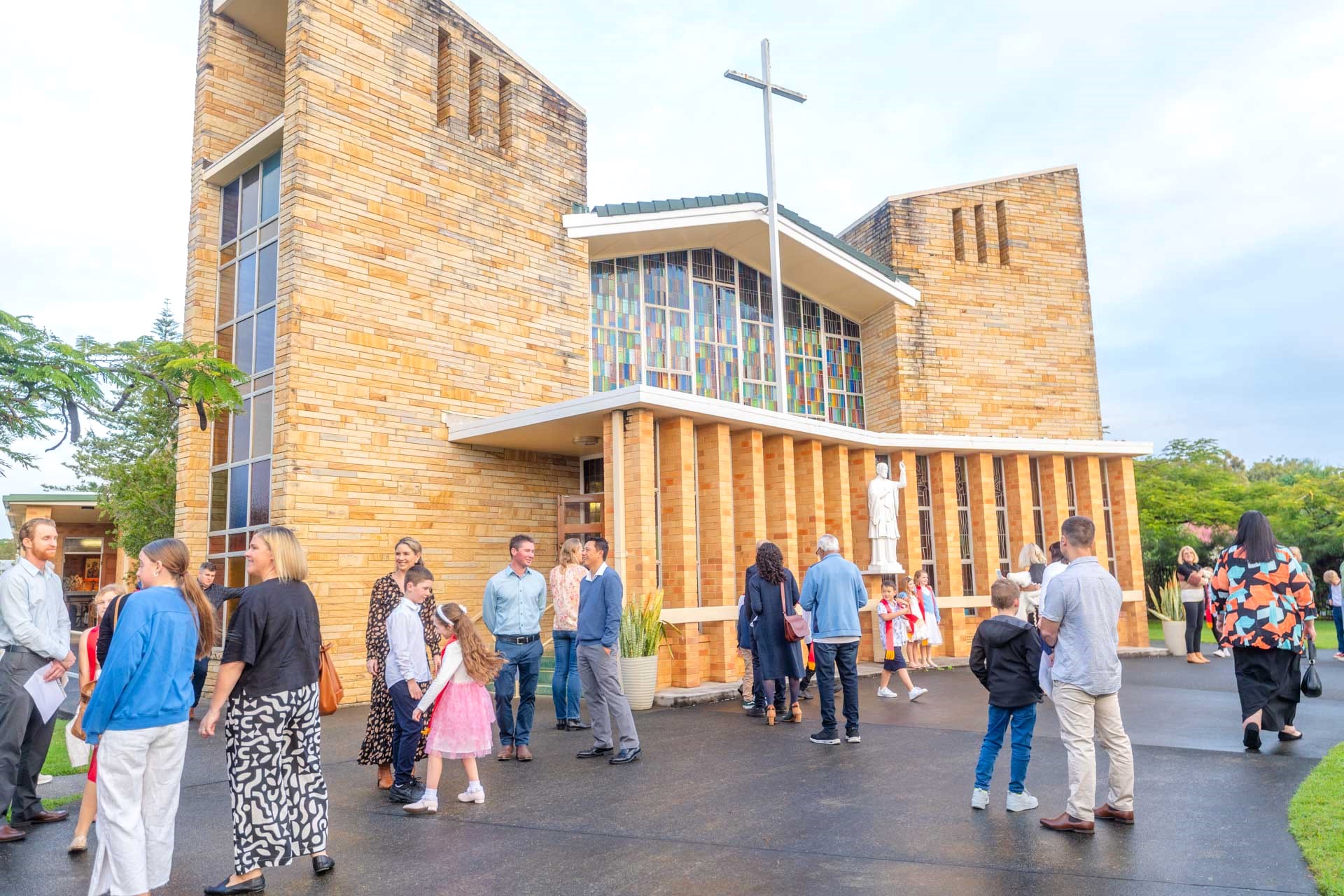 People waiting outside church for service,